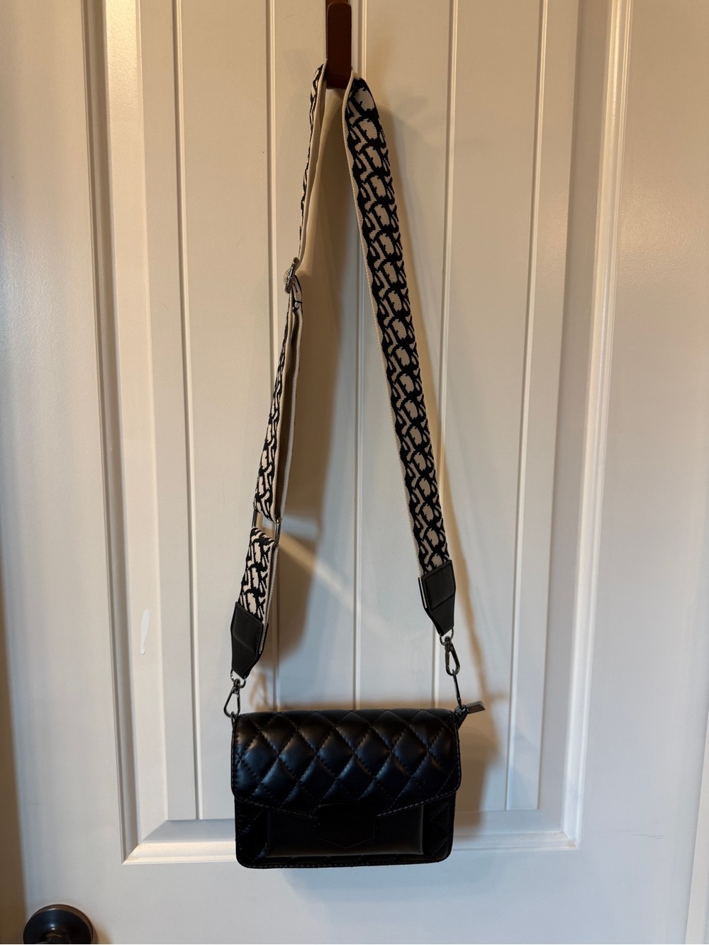 Black Quilted Crossbody Bag with Patterned Strap